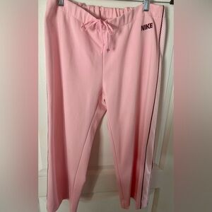 Nike Pink Athletic pants with accent side stripe. Size L